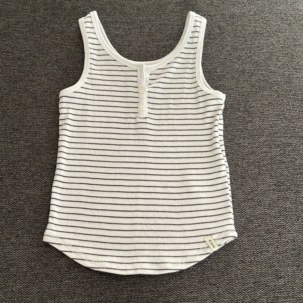 Girls size 9/10 tank top. Navy and white striped with button detail.